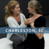 Icon for Phoenix Rising Essentials, showing two women facing each other, hands over one's heart